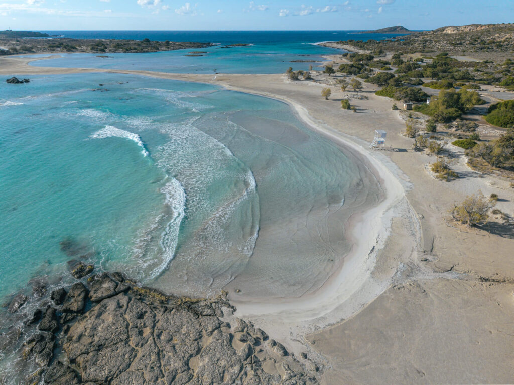 Aerial photograph of pale sand and shallow water at Elafonisi Beach in winter light.