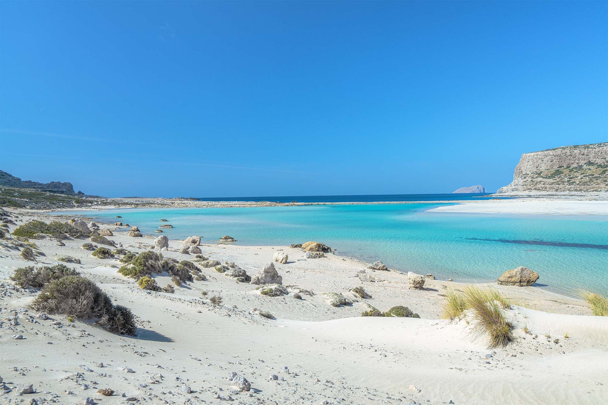 Balos Lagoon in Crete with white sand, turquoise water and Gramvousa Island.