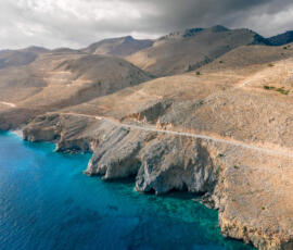 Quiet coastal cliffs along Crete’s remote southern shore. Aerial view of the coastal cliffs near Chora Sfakion on Crete’s south coast.