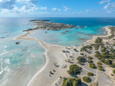 Graphic lines, shapes, and colours of Elafonisi’s lagoon. Aerial view of Elafonisi lagoon showing turquoise pools and sand formations.