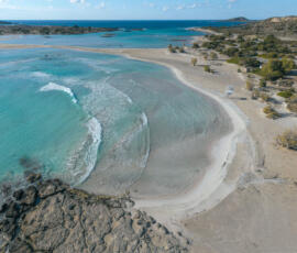 Soft colors and delicate shoreline patterns at Elafonisi. Aerial photograph of pale sand and shallow water at Elafonisi Beach in winter light.