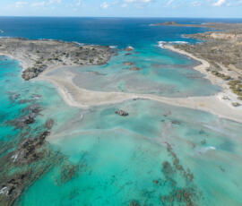 Pastel turquoise waters and empty sandbars at Elafonisi. Aerial photo of Elafonisi Beach with empty sandbars and turquoise water in November.