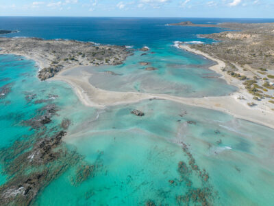 Pastel turquoise waters and empty sandbars at Elafonisi. Aerial photo of Elafonisi Beach with empty sandbars and turquoise water in November.