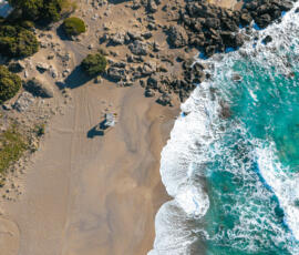 A peaceful view of Falassarna Beach, where turquoise water meets golden sand under the open Cretan sky. Falassarna Beach in western Crete with turquoise sea, sandy shore, and calm summer atmosphere.